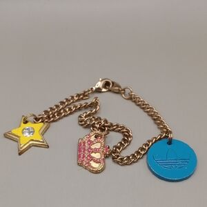 Vintage Gold Charm Bracelet with Star, Crown, and Blue Disc